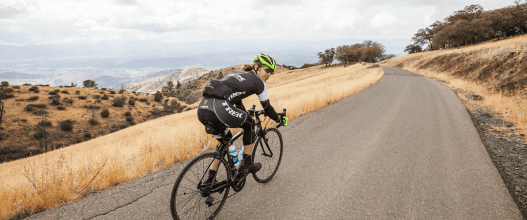 Person riding their bike on a paved road