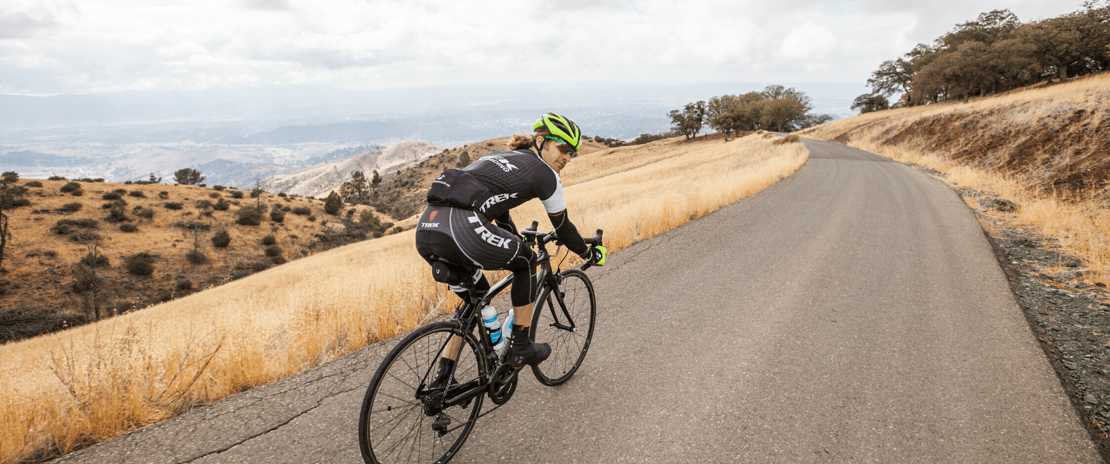 Person riding their bike on a paved road