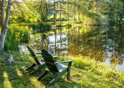 2 chairs along the river at Lakedale Resort