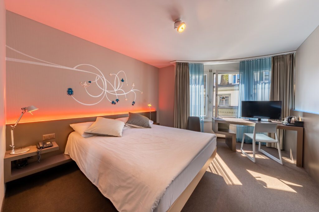 Modern hotel room with double bed